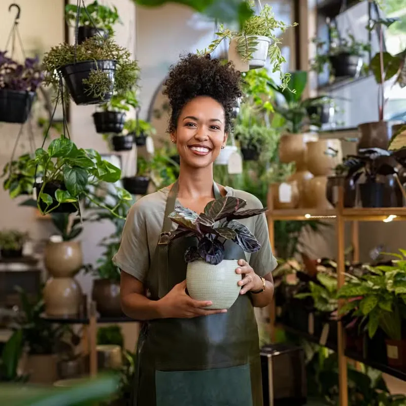 Smiling plant shop owner